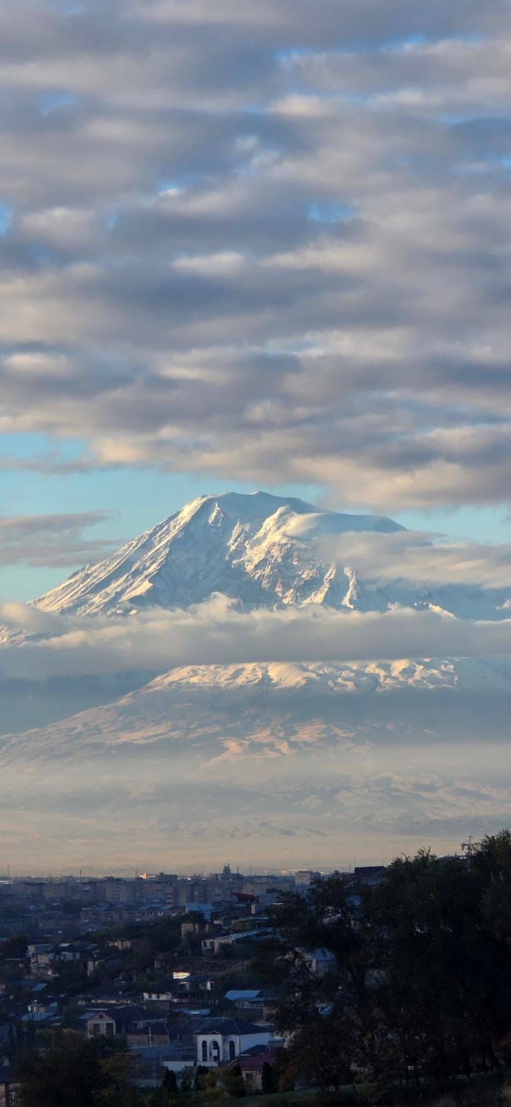 Snow-covered Mount Ararat above the rooftops of Yerevan at first light