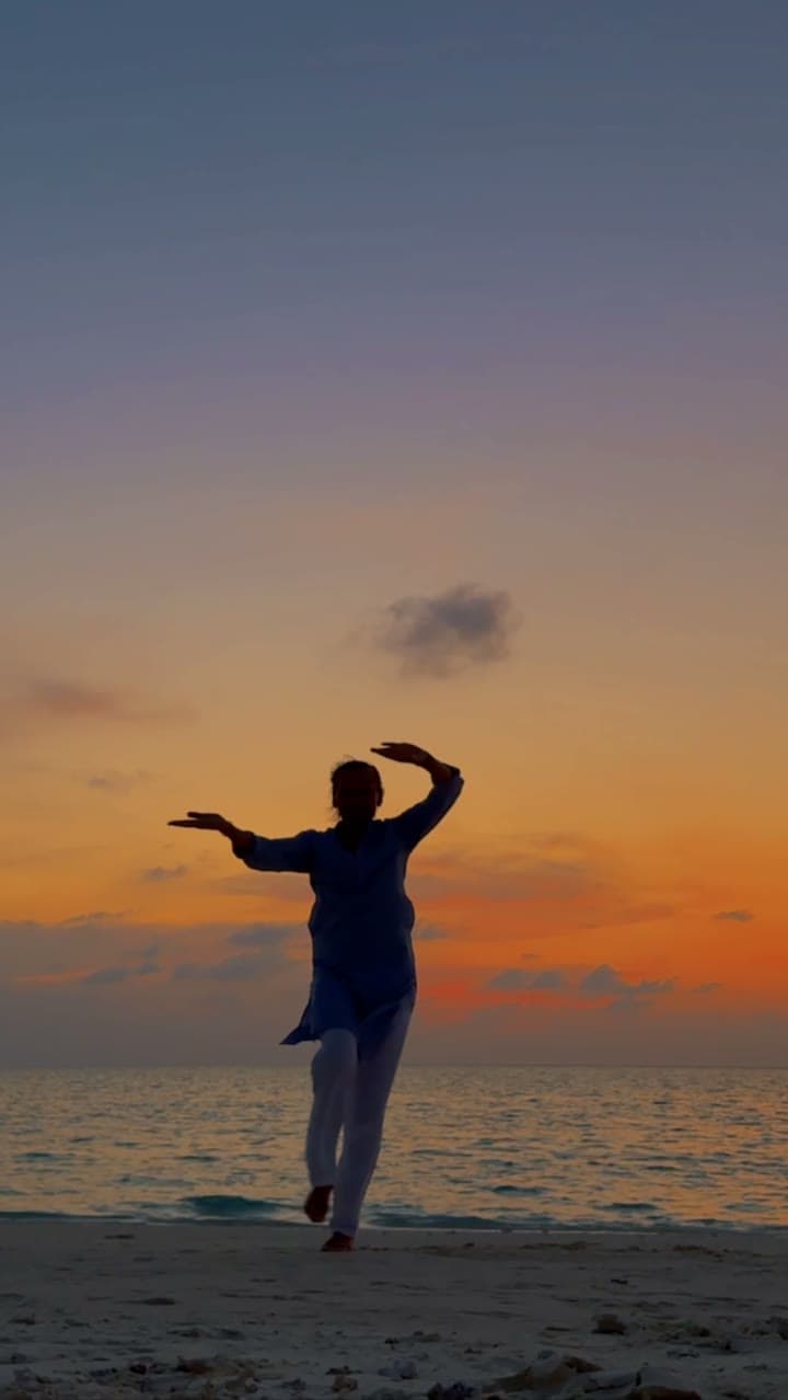 Flowing movement on the beach at sunset