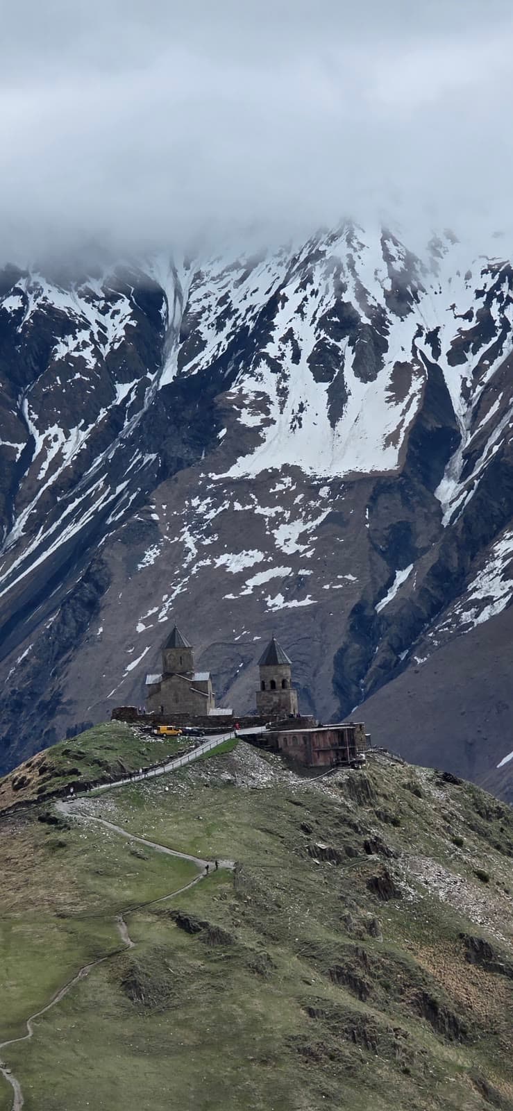 Gergeti Trinity Church on its ridge below the snows of Mount Kazbek