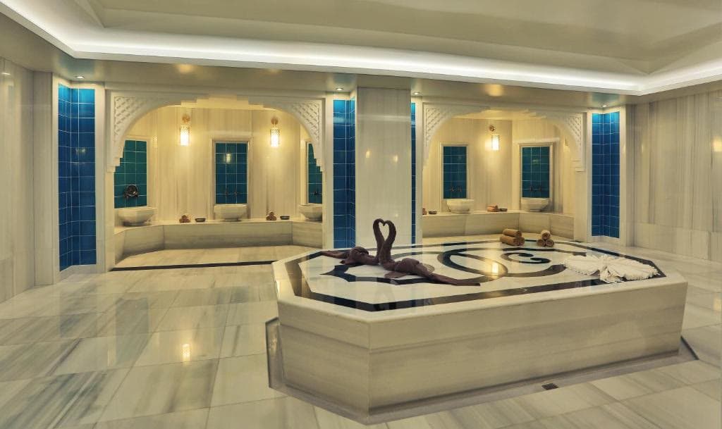 A private thermal and mineral water bathing room in pale stone