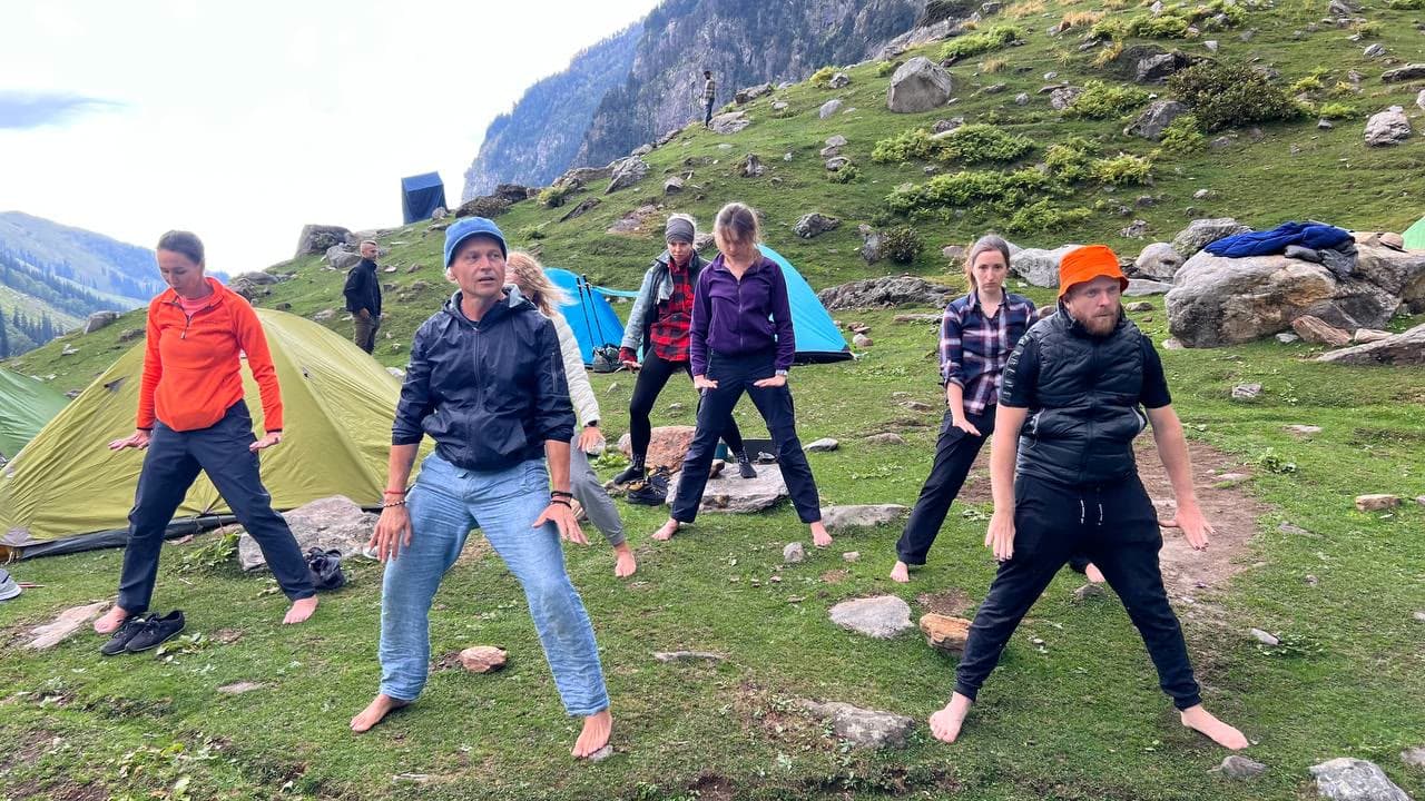 Group qigong practice at a Himalayan camp
