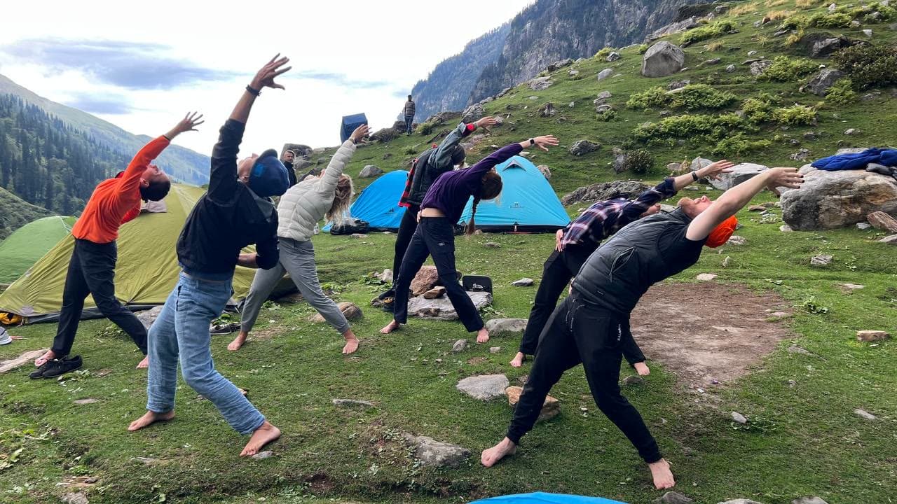 Group stretching practice in the Himalayas