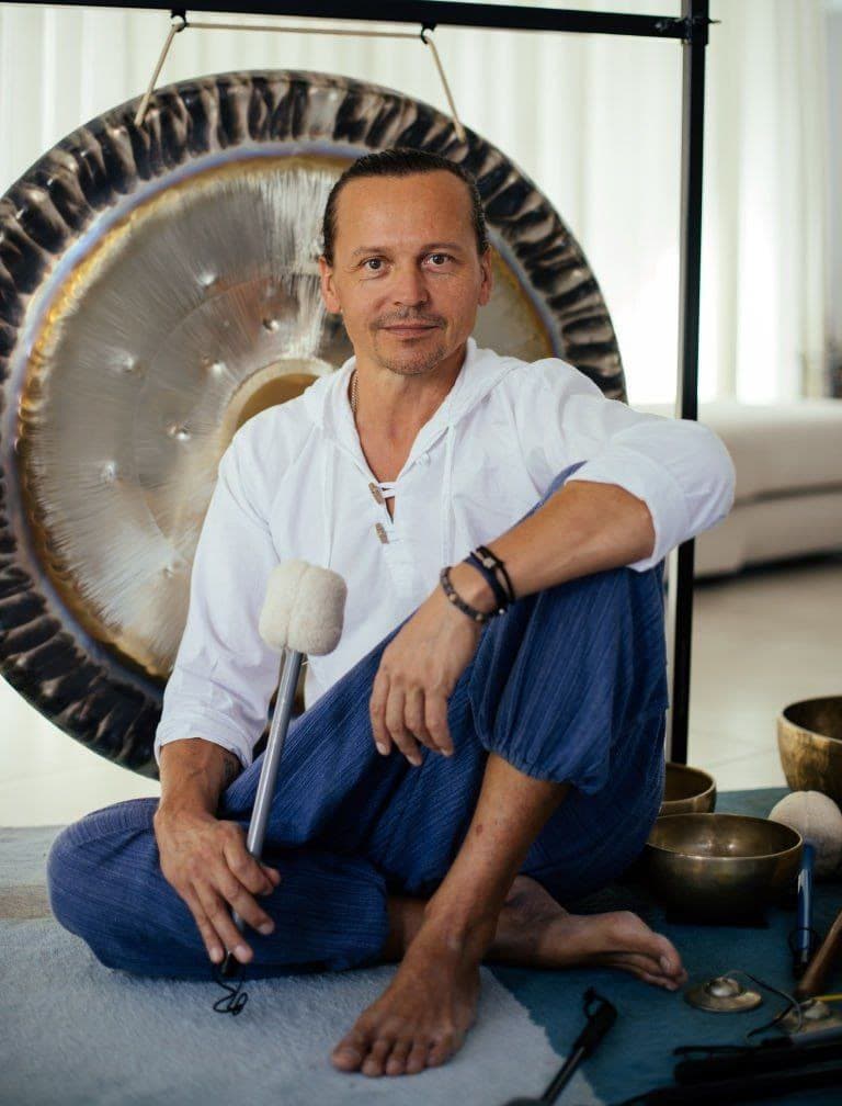 Alexander seated with a gong