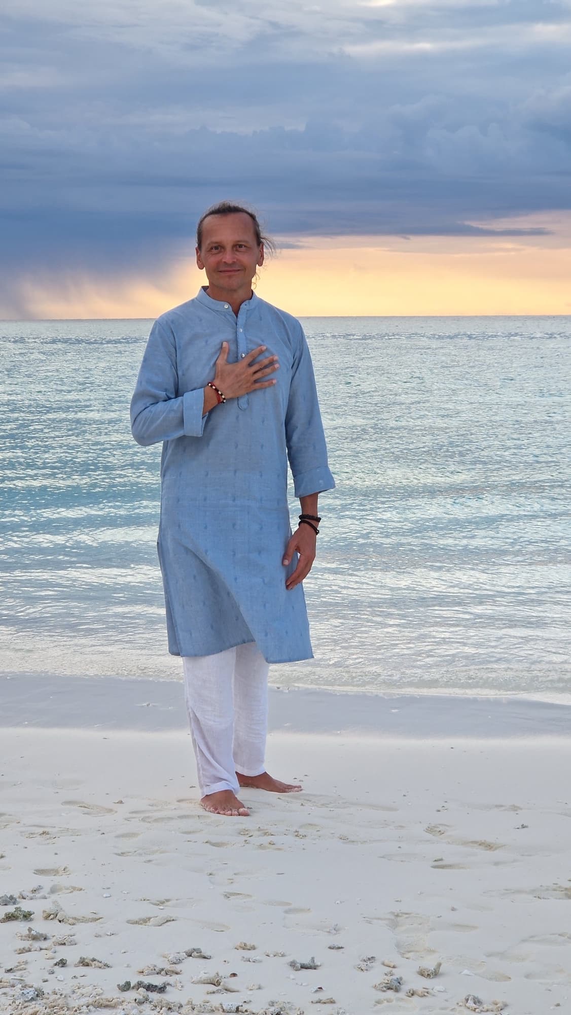 Portrait of Alexander, founder of Taste of Life, on the shore at dusk
