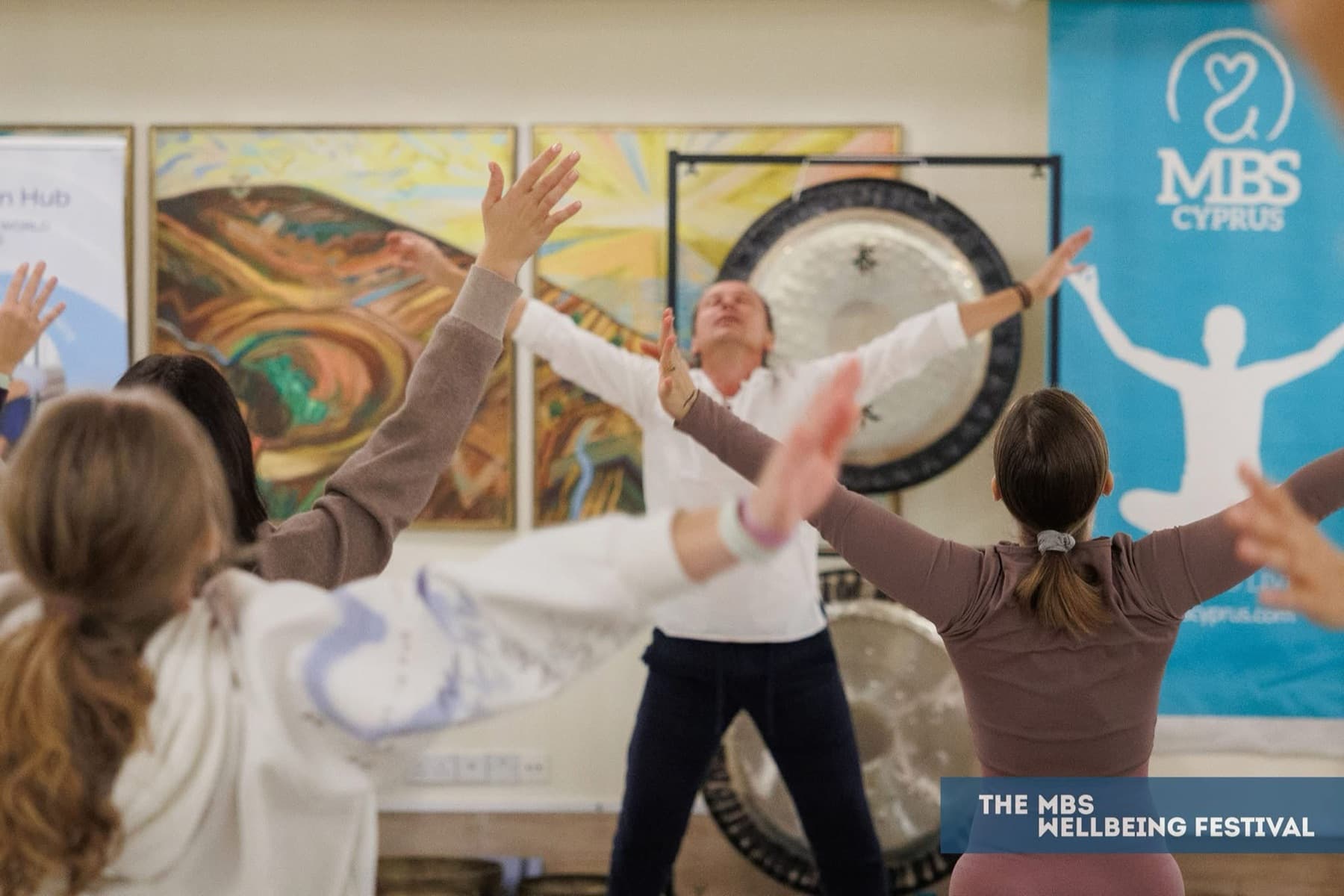 Guided movement and breath practice in a light-filled hall