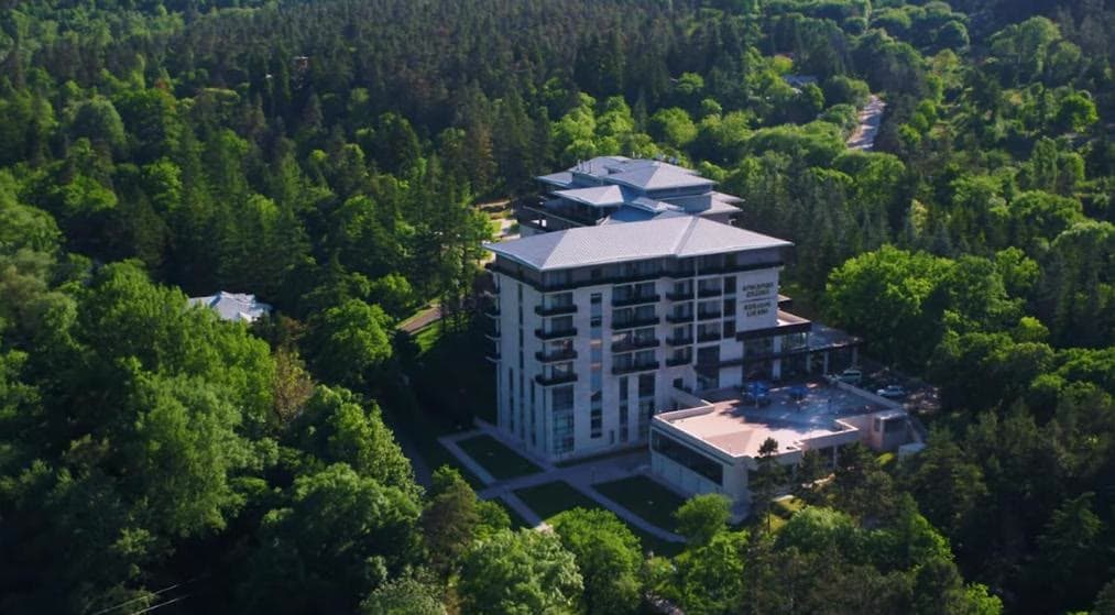 The Borjomi Likani hotel from the air, ringed by the forests of Borjomi National Park